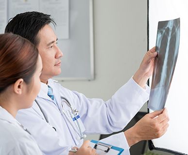 Doctor and nurse viewing a chest X-ray