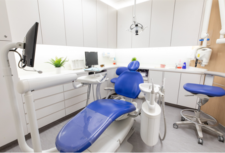 Dental examination room with blue chair